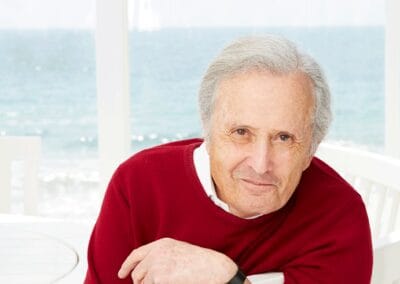 Bert_Fields_066_r2-11-e1400165869924 A man wearing a red sweater.