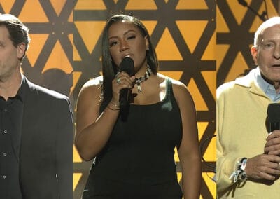 I-Am-MPTF-1 Three people standing next to each other holding microphones.