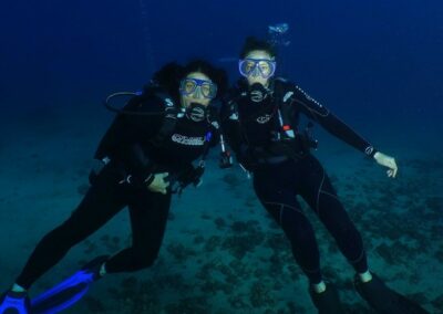 Maria Victoria Two scuba divers posing for a photo.