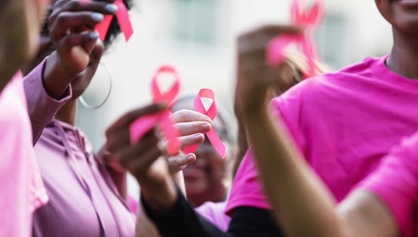 Breast Cancer Awareness Ribbons In Women’s Hands Breast Cancer Awareness Ribbons In Women's Hands